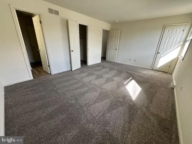 a view of empty room with front door
