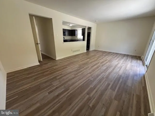 a view of a livingroom with wooden floor