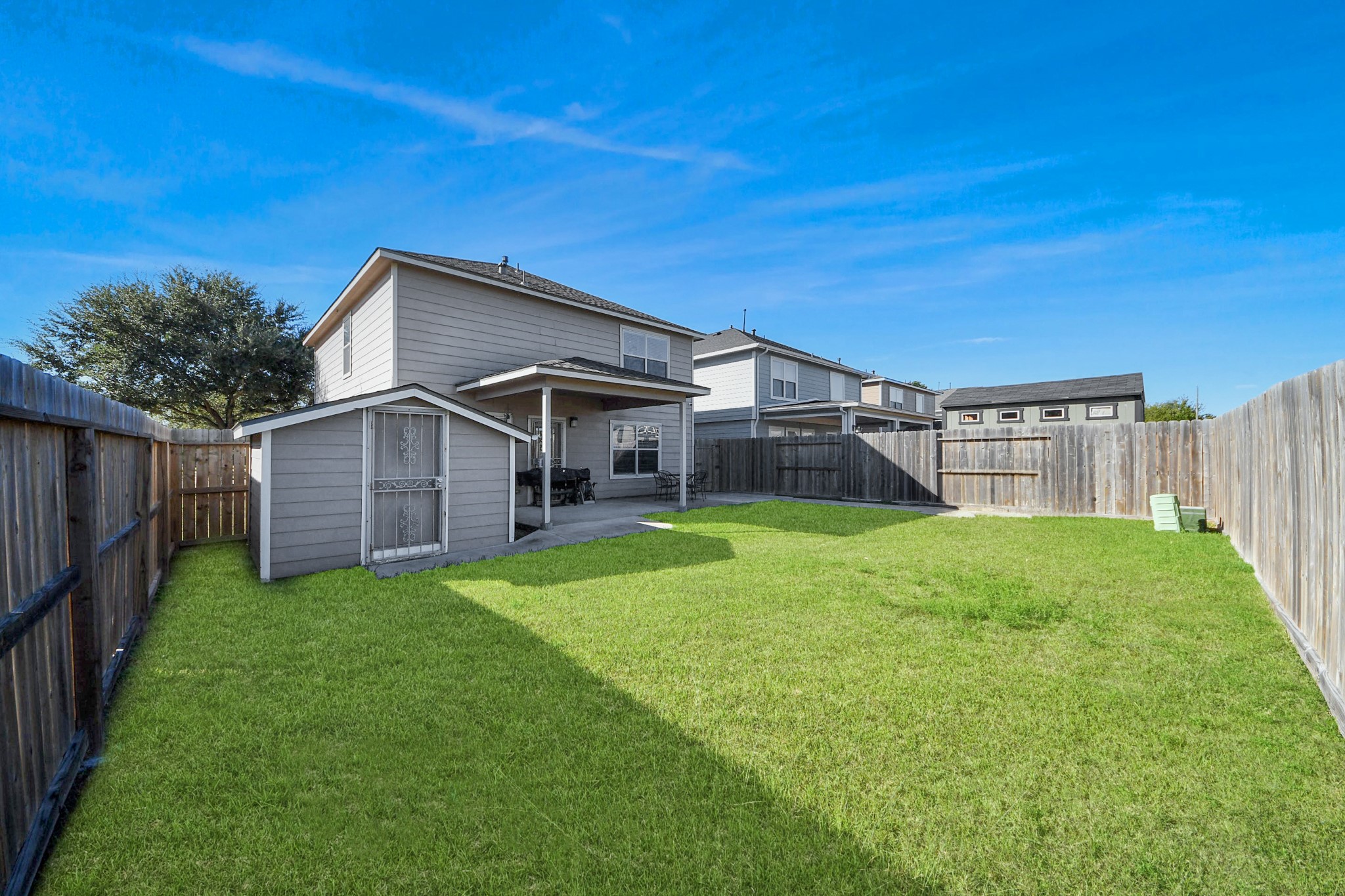 6902 Anson Point Lane Houston, TX 77040 - Photo 33 of 40 a view of a house with backyard and porch
