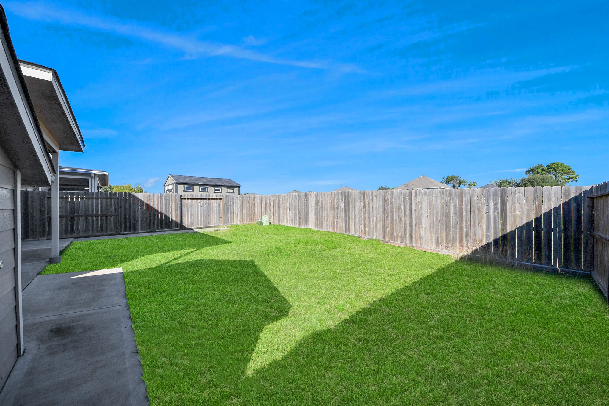 6902 Anson Point Lane Houston, TX 77040 - Photo 34 of 40 a view of a backyard with a garden