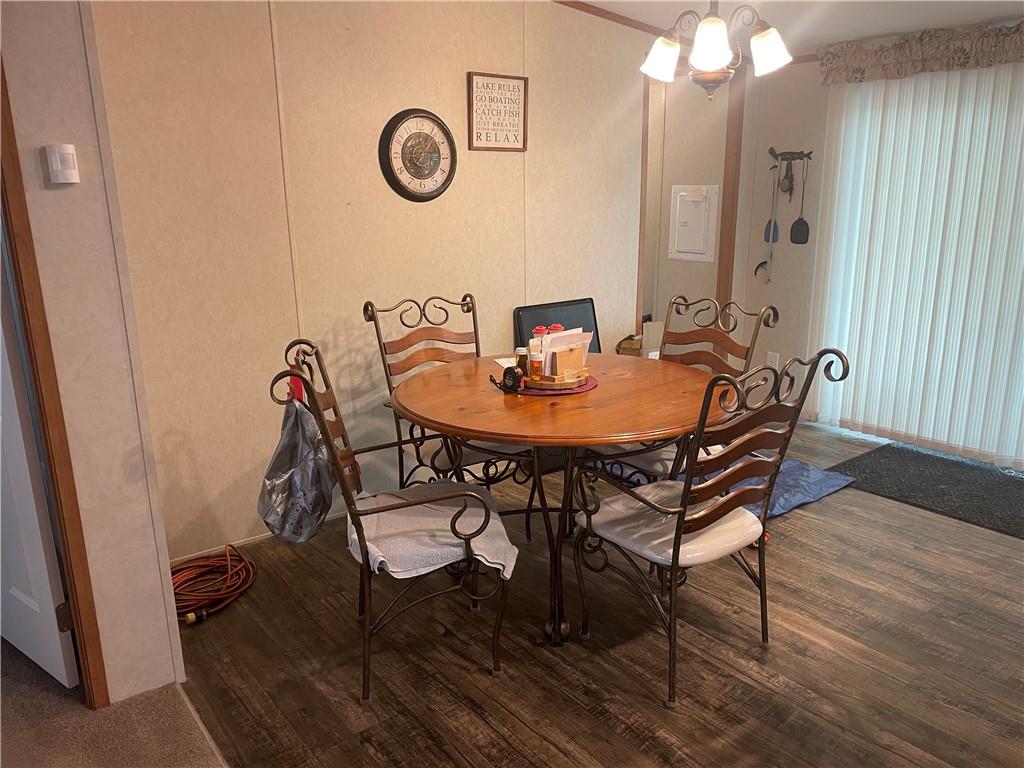 14624 Gilliland Road Linesville, PA 16424 - Photo 14 of 23 a view of a dining room with furniture and wooden floor