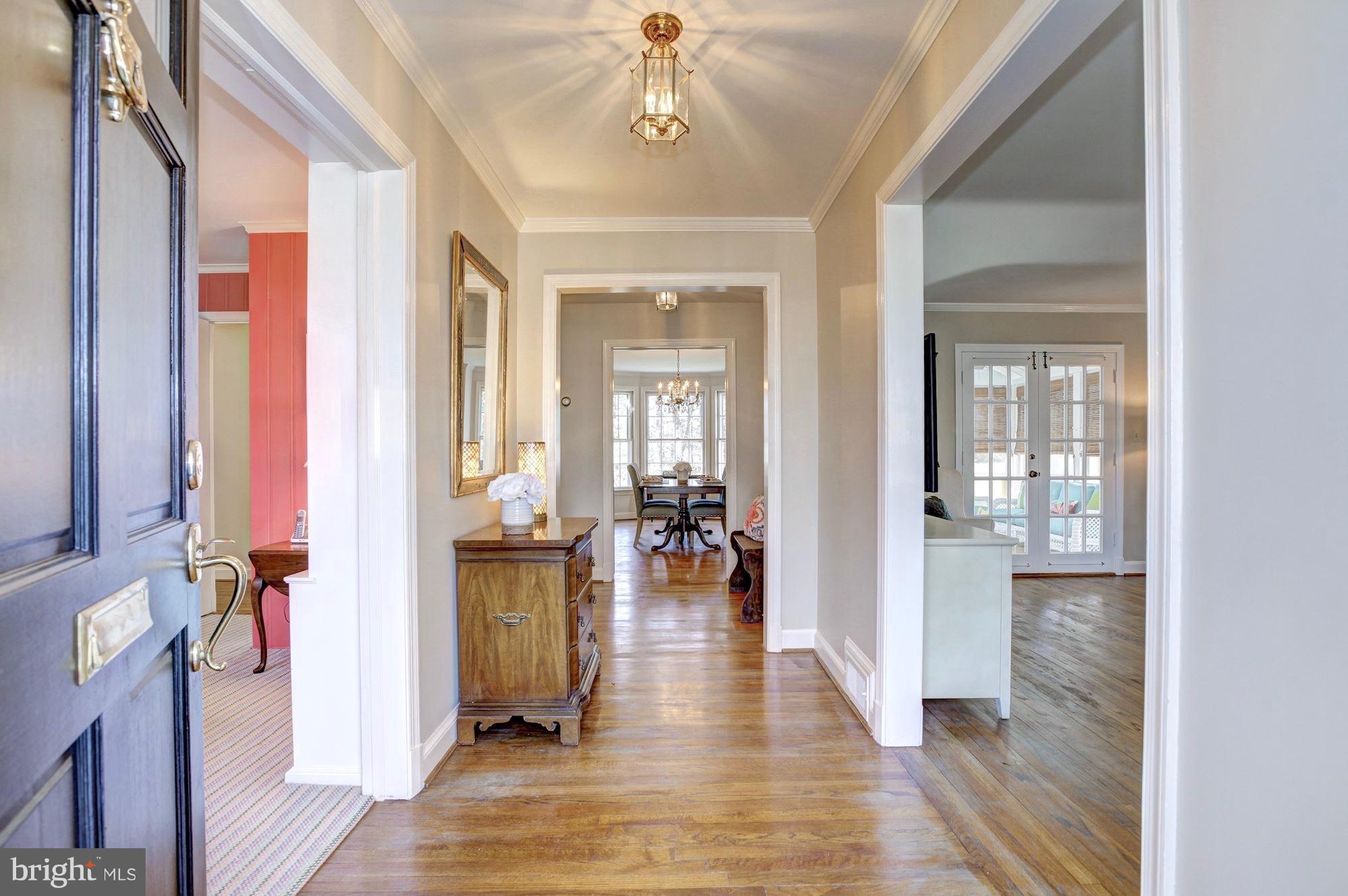 9904 Old Spring Road Kensington, MD 20895 - Photo 2 of 29 Glowing hardwoods and formal foyer greets guests.