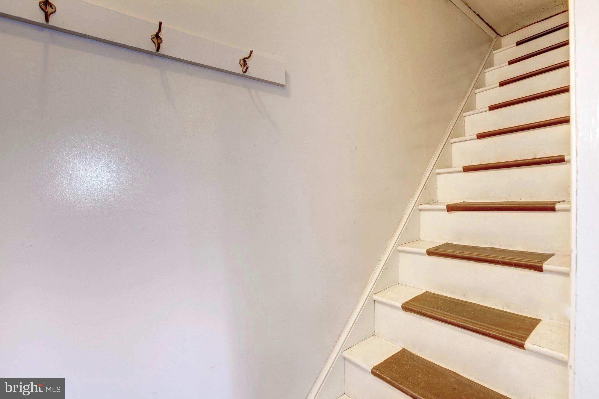 9904 Old Spring Road Kensington, MD 20895 - Photo 19 of 29 Stairs lead to huge, unfinished attic.