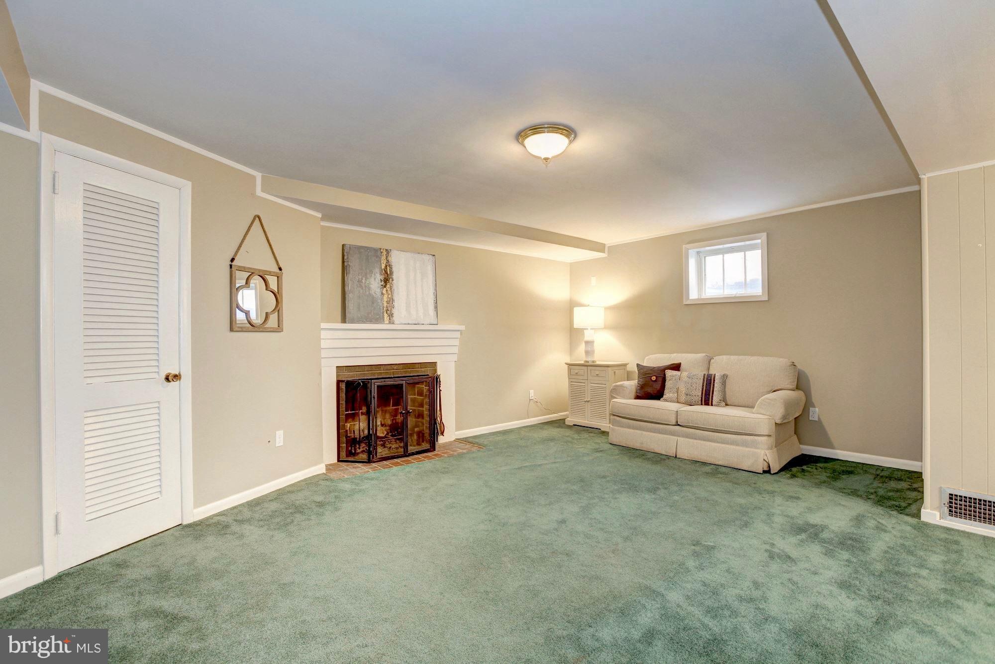9904 Old Spring Road Kensington, MD 20895 - Photo 21 of 29 Large rec room with fireplace.