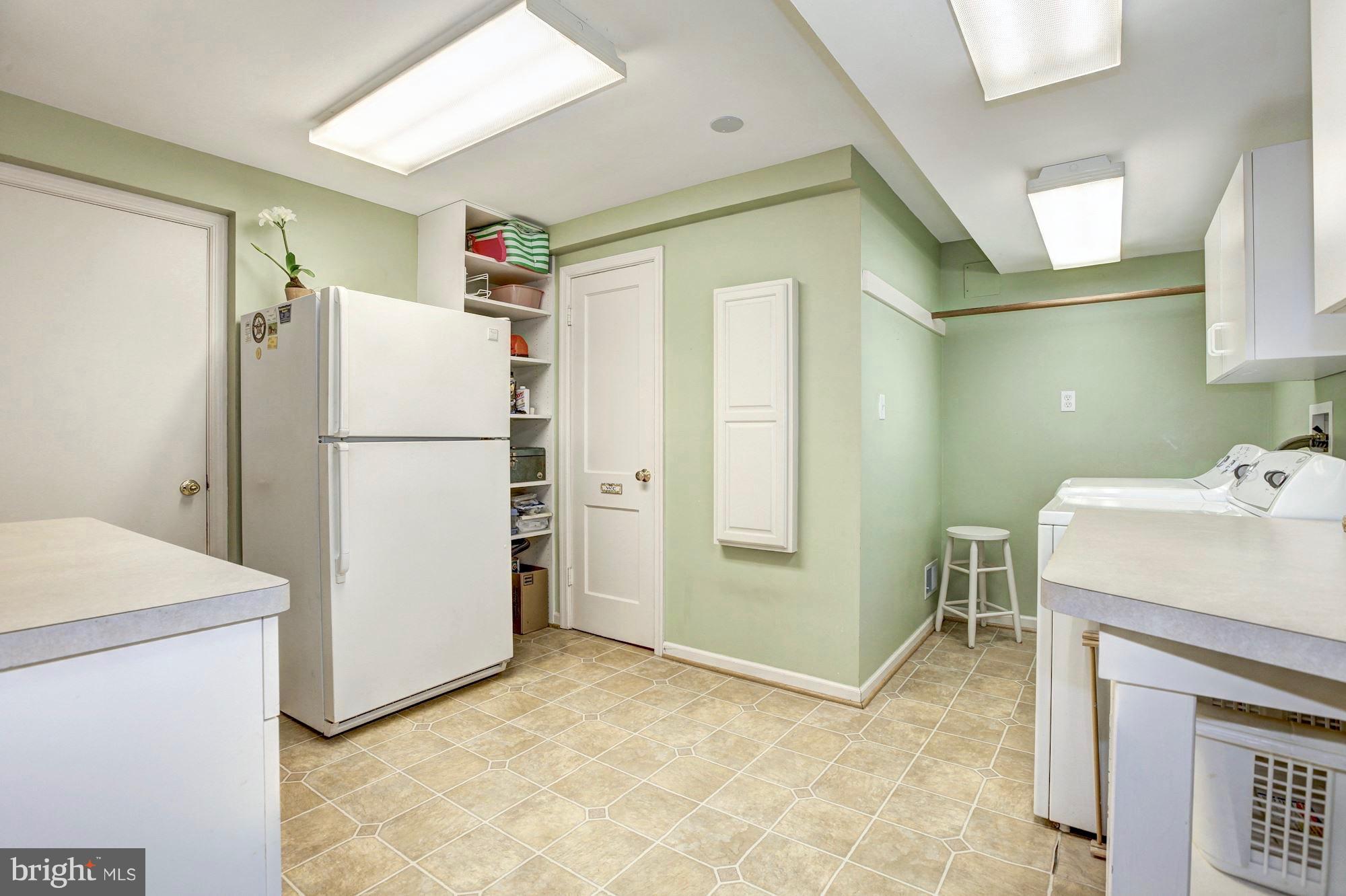 9904 Old Spring Road Kensington, MD 20895 - Photo 24 of 29 Bright laundry with full bath.