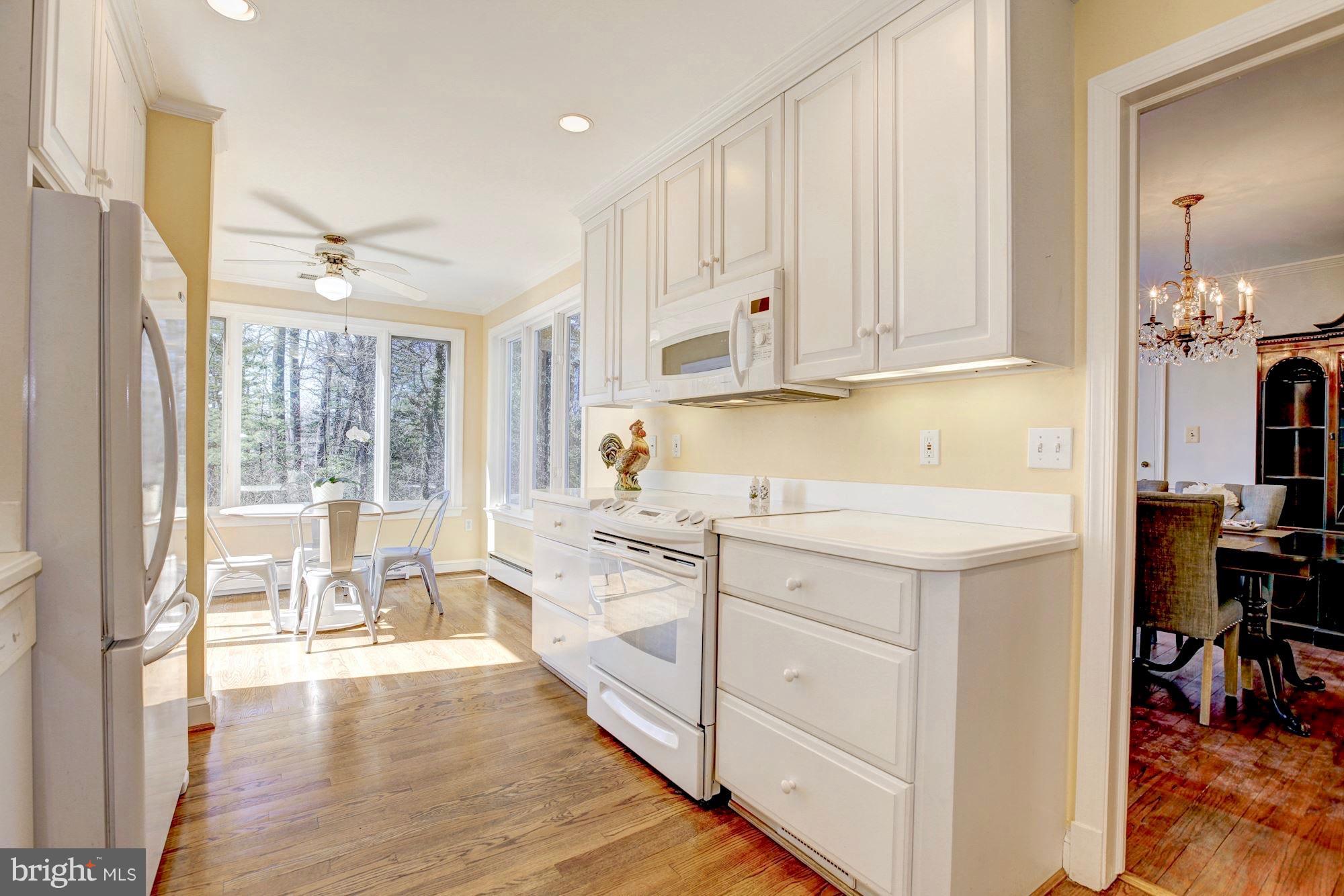 9904 Old Spring Road Kensington, MD 20895 - Photo 10 of 29 Wood floors and loads of light.