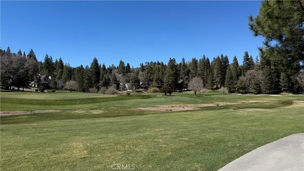 a view of a golf course with a lake