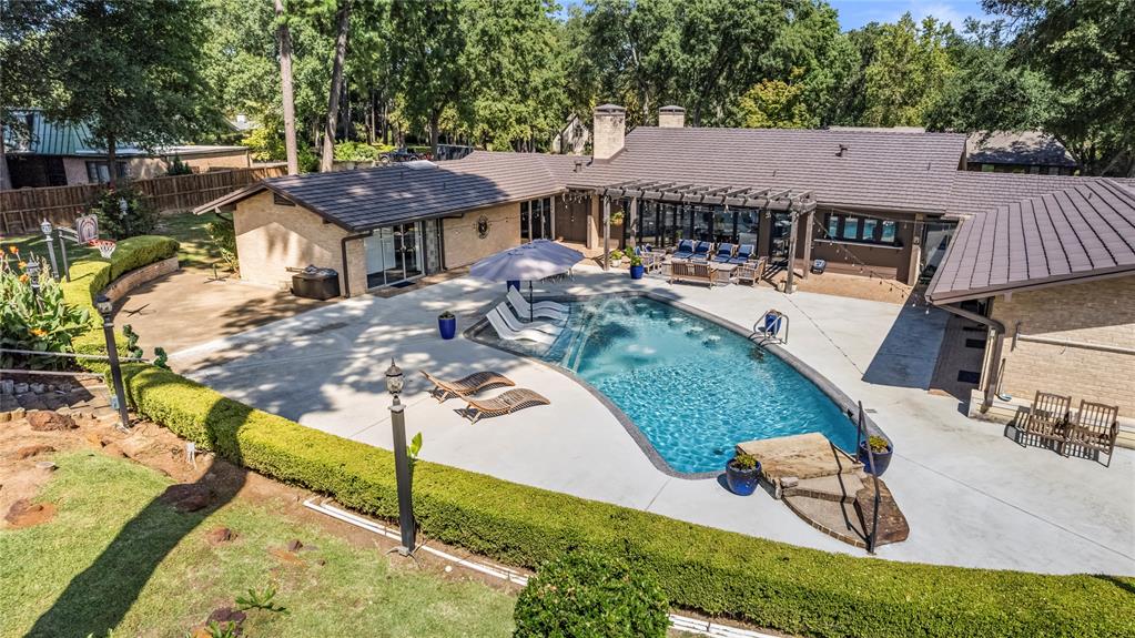 1300 Montclair Street Longview, TX 75601 - Photo 31 of 39 View of pool featuring a pergola, a patio, and a fenced backyard