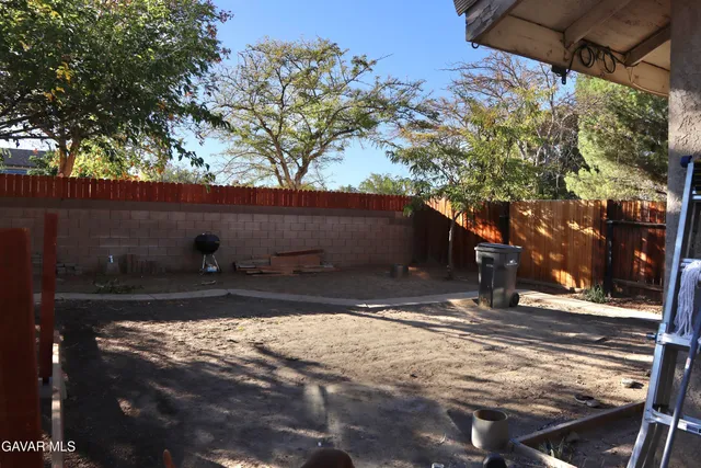 a view of a backyard of the house