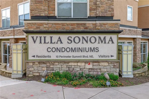 a bedroom with a large bed and a flat screen tv