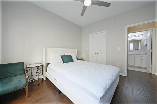 front view of a brick building next to a yard