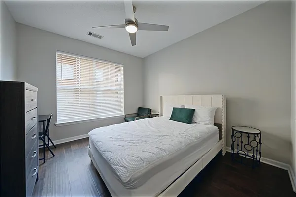 an aerial view of a house with a yard basket ball court and outdoor seating