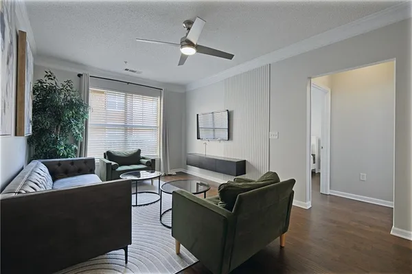 a view of a house with a swimming pool and a patio