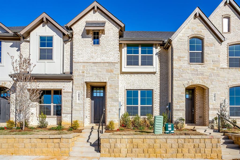 6817 Robert Reed Drive Arlington, TX 76001 - Photo 2 of 40 a view of a white house with large windows and a table and chairs