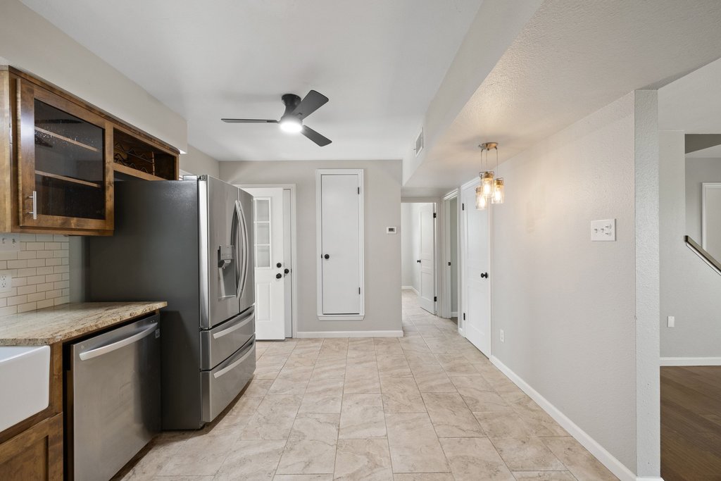 2206 Jacks Pass Austin, TX 78734 - Photo 11 of 35 a view of a refrigerator in kitchen and window