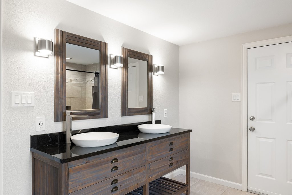 2206 Jacks Pass Austin, TX 78734 - Photo 23 of 35 a bathroom with double sink and two mirror