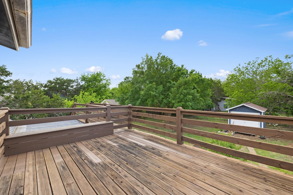 2206 Jacks Pass Austin, TX 78734 - Photo 26 of 35 a view of balcony with wooden floor and fence