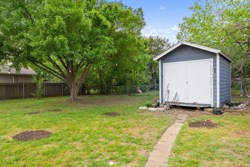 2206 Jacks Pass Austin, TX 78734 - Photo 29 of 35 a view of backyard with a garden and trees