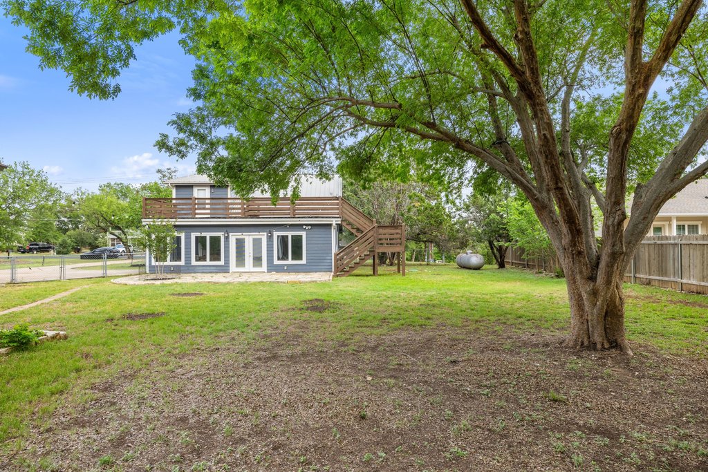 2206 Jacks Pass Austin, TX 78734 - Photo 31 of 35 a view of house with outdoor space and garden