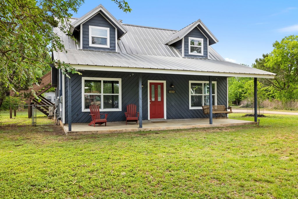2206 Jacks Pass Austin, TX 78734 - Photo 32 of 35 a view of a house with a yard and sitting area