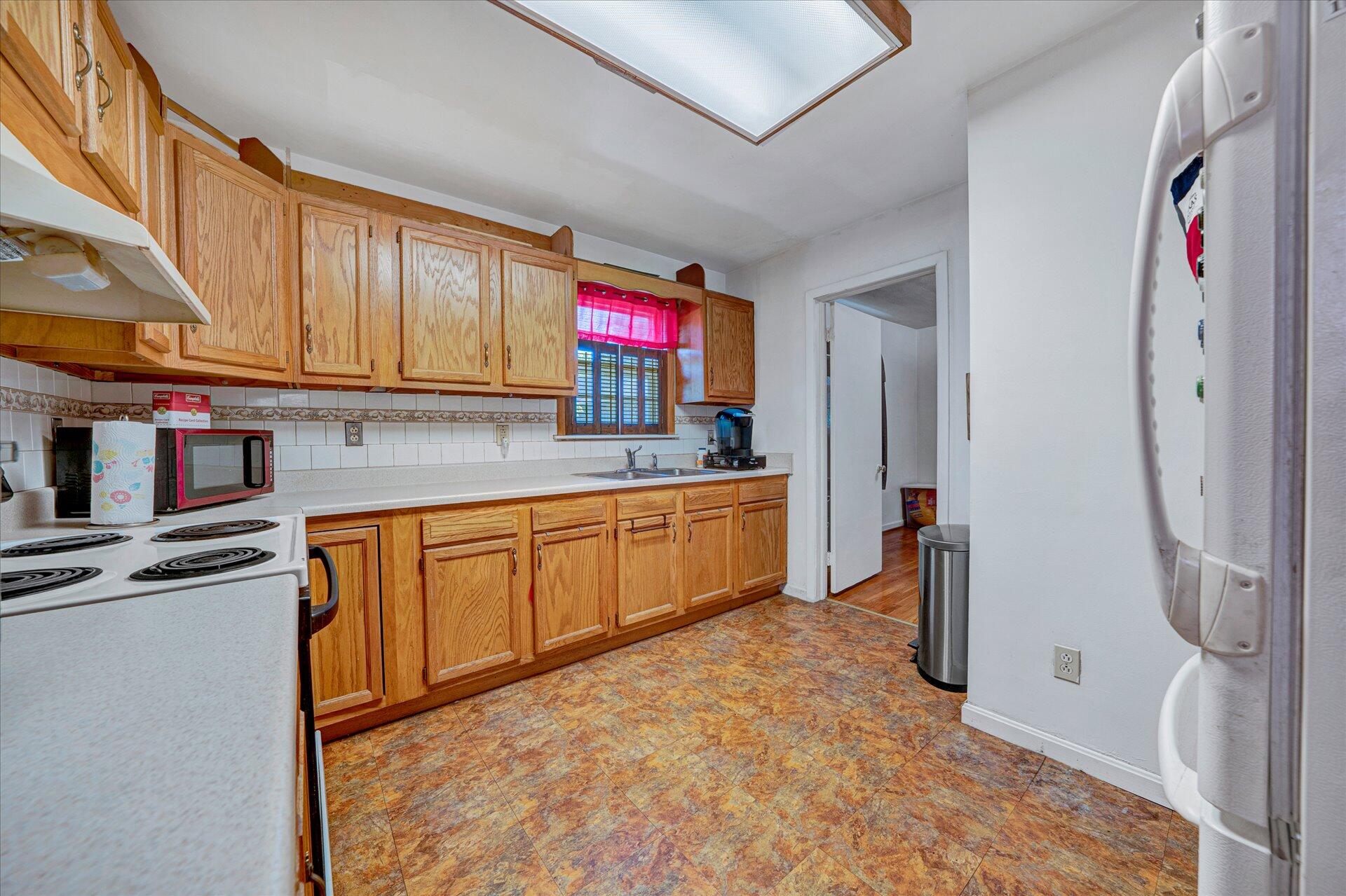 1926 Burma Road Salem, VA 24153 - Photo 4 of 16 a kitchen with stainless steel appliances granite countertop a stove a sink and a refrigerator