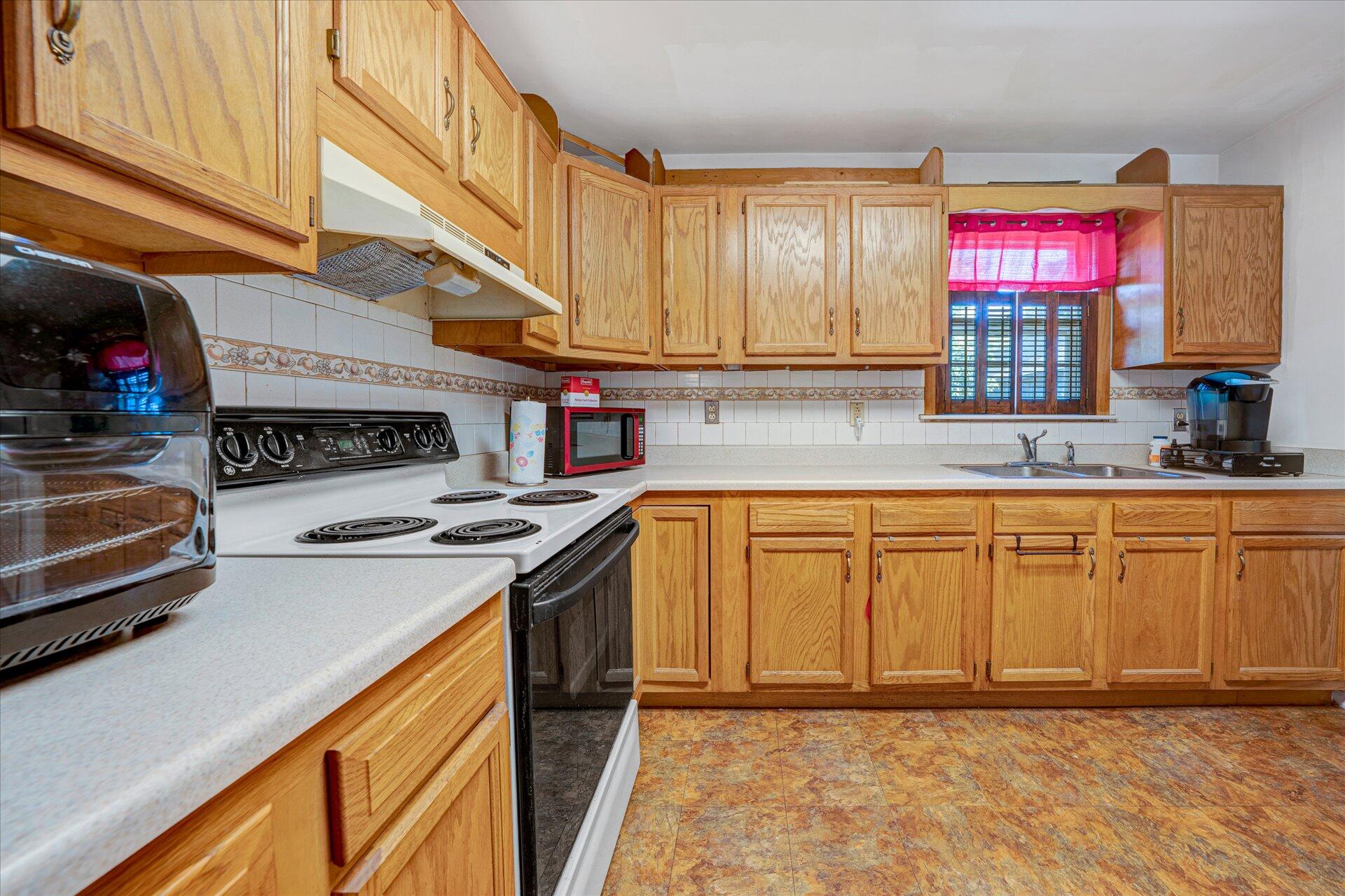 1926 Burma Road Salem, VA 24153 - Photo 5 of 16 a kitchen with stainless steel appliances granite countertop a sink stove and cabinets
