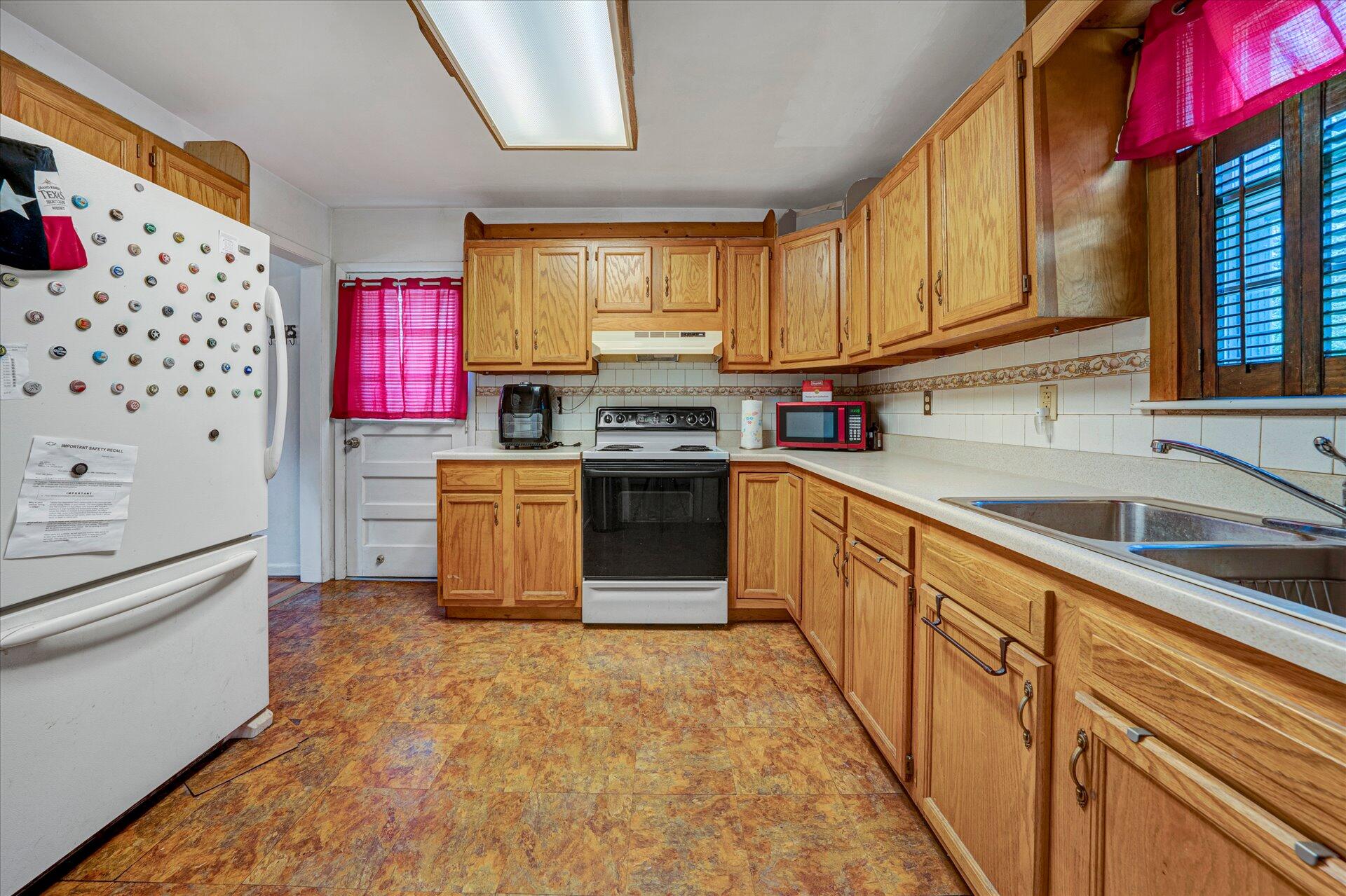 1926 Burma Road Salem, VA 24153 - Photo 6 of 16 a kitchen with stainless steel appliances granite countertop a stove a sink and a refrigerator