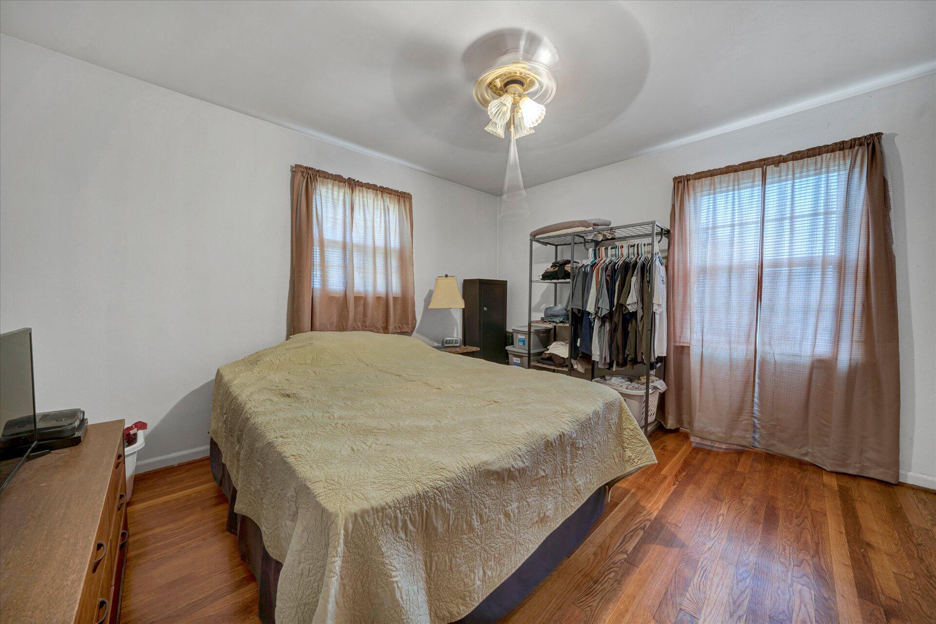 1926 Burma Road Salem, VA 24153 - Photo 10 of 16 a bed sitting in a spacious bedroom next to a window and a chandelier