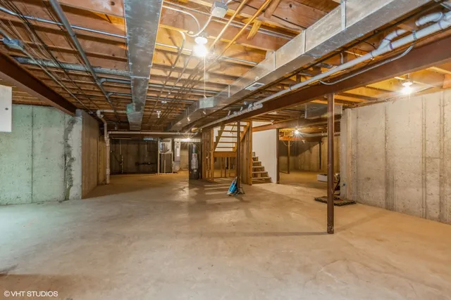 a view of empty room with wooden walls