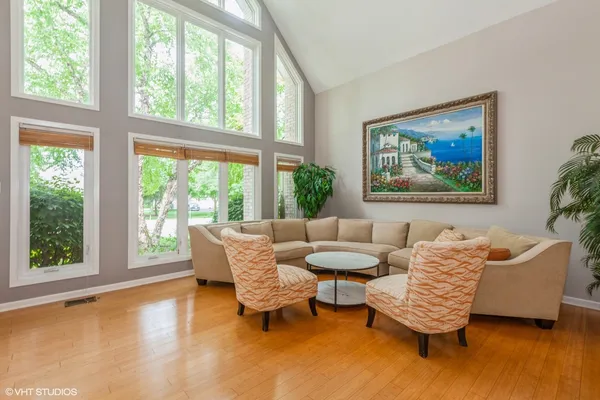 a living room with furniture and a large window