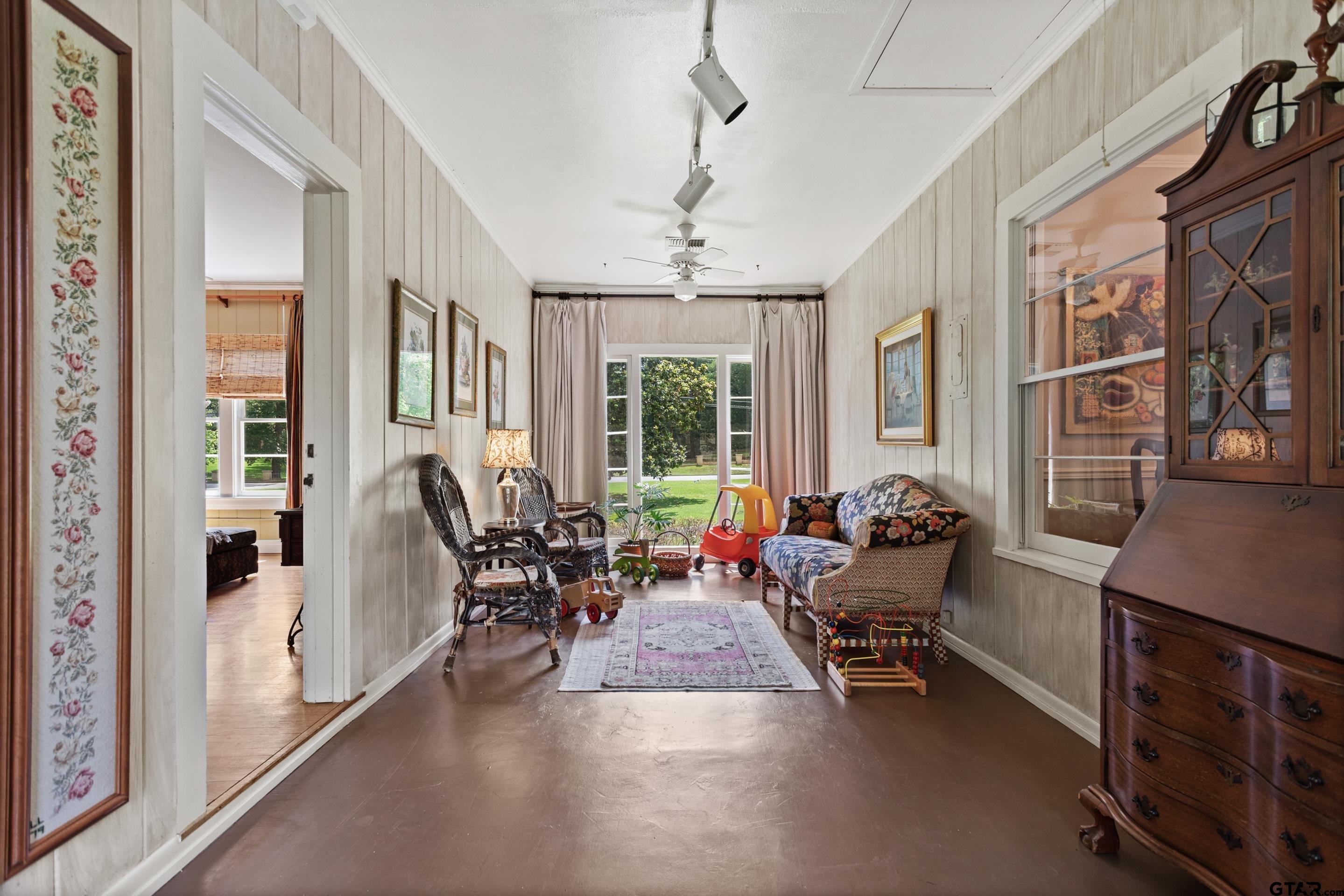 2631 Old Bullard Road Tyler, TX 75701 - Photo 33 of 43 a living room with furniture windows and a chandelier