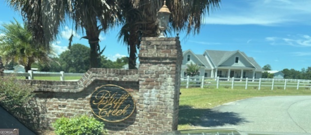 a view of swimming pool with a garden and plants