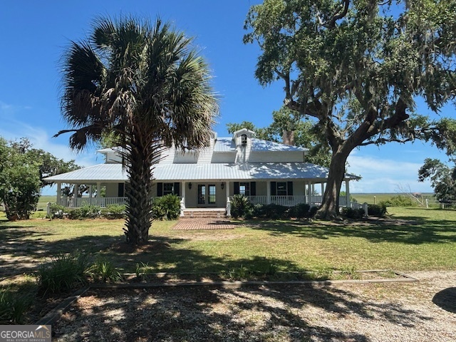 3 Bluff Creek Road Midway, GA 31320 - Photo 5 of 16 a front view of a building with trees around