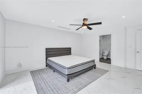 a living room with furniture and white walls