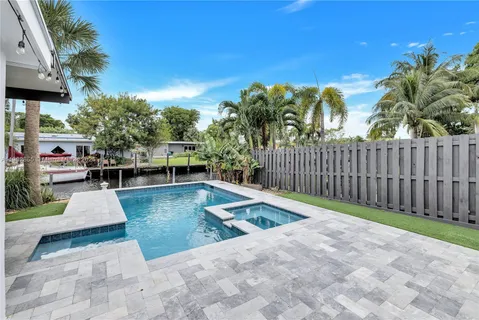 a view of a backyard with sitting area