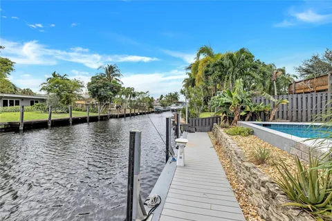 a lake view with a wooden bridge