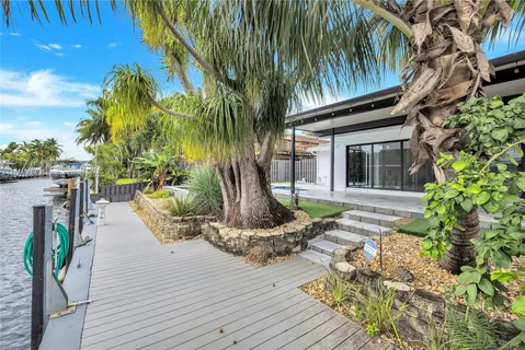 a view of a lake with boats and trees in the background