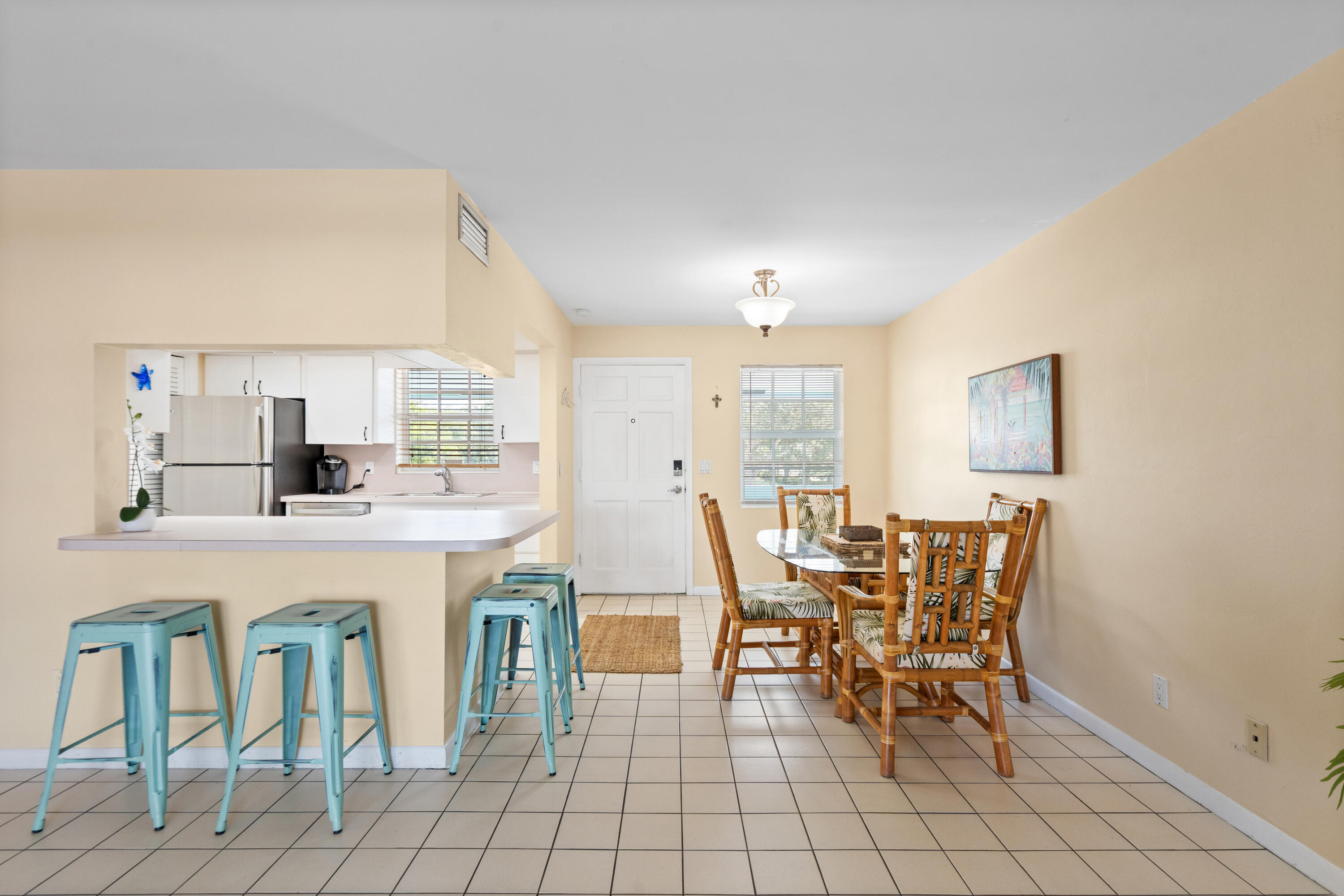 249 Center Street, Unit 2C Jupiter, FL 33458 - Photo 9 of 29 a dining room with furniture and window