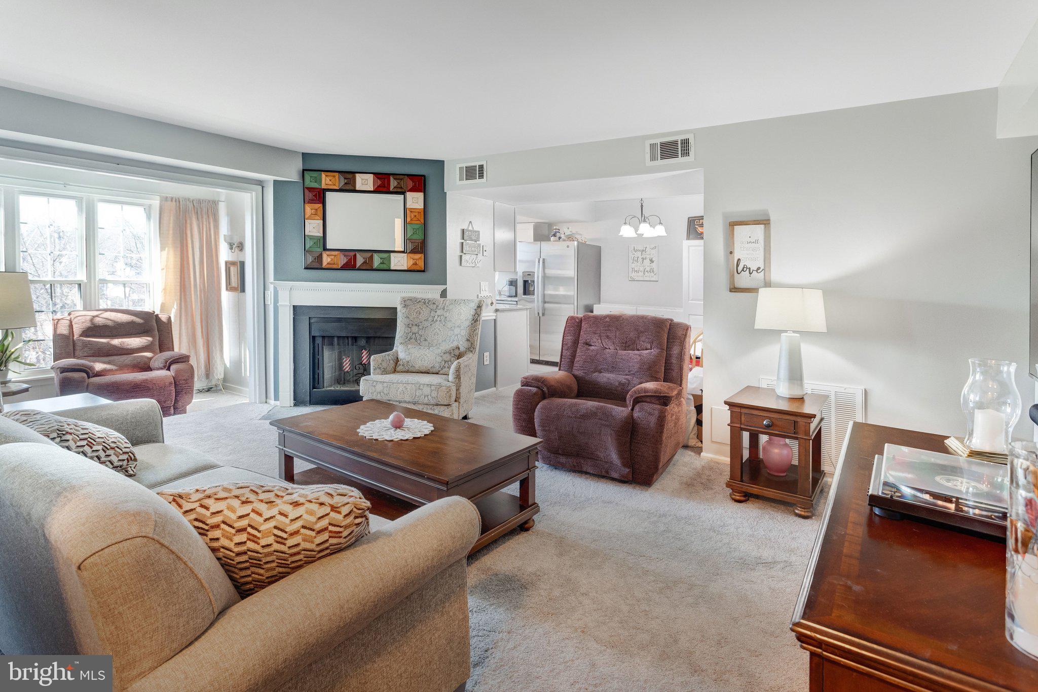 125 Fort Evans Road Southeast, Unit D Leesburg, VA 20175 - Photo 6 of 25 Living room w/fireplace & sitting area