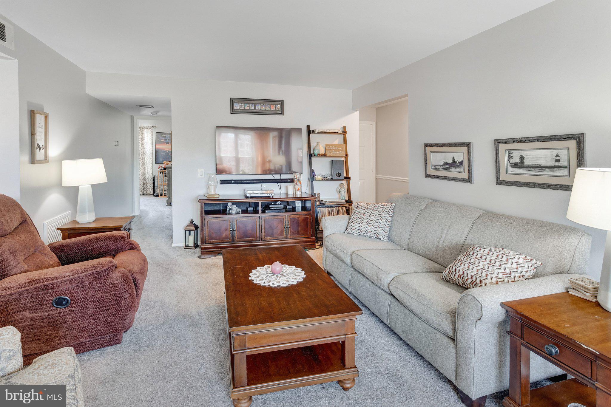 125 Fort Evans Road Southeast, Unit D Leesburg, VA 20175 - Photo 7 of 25 Living room w/fireplace & sitting area