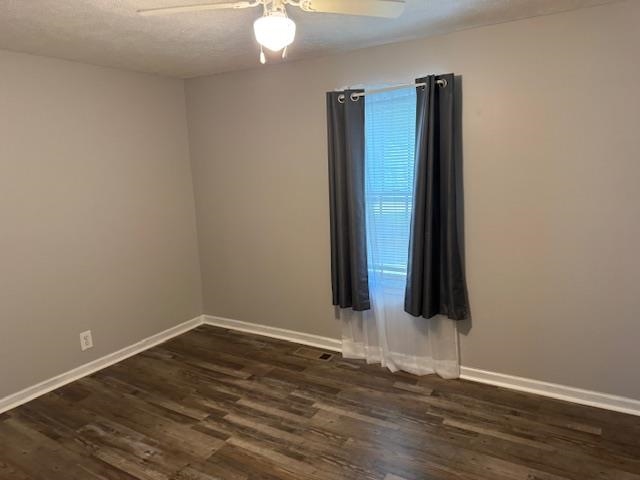 320 Rabbit Ranch Road Henderson, TN 38340 - Photo 14 of 29 Wood-finish flooring, neutral wall color, ceiling fan with integrated lighting, and window with blinds