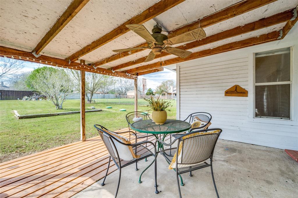 629 Concho Drive Oak Point, TX 75068 - Photo 28 of 35 a patio with garden area and outdoor seating