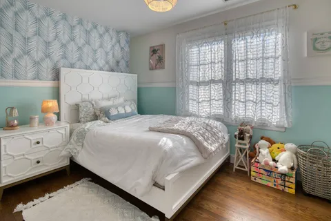 a bedroom with a bed and window