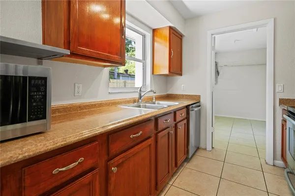 a kitchen with a sink and cabinets