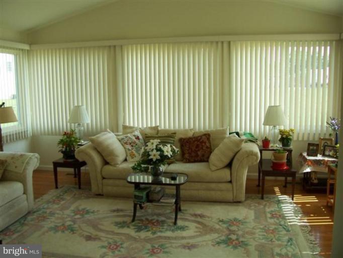 25813 Hunters Point Lane Denton, MD 21629 - Photo 3 of 5 a living room with furniture and a large window