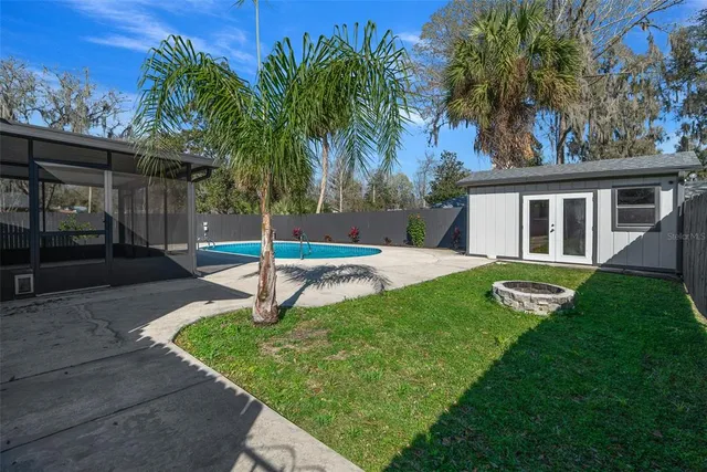 a house with green field in front of it