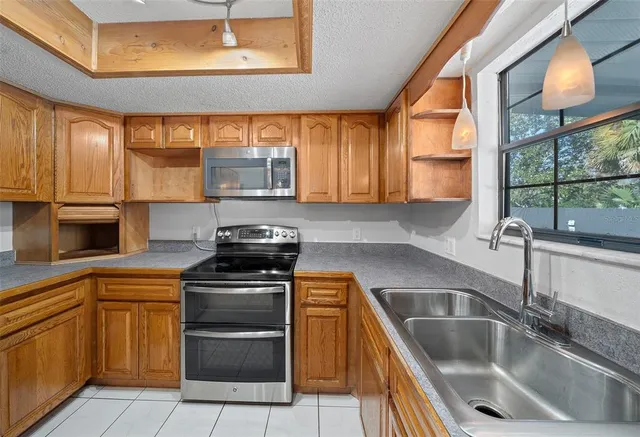 a view of a room with cabinet and windows
