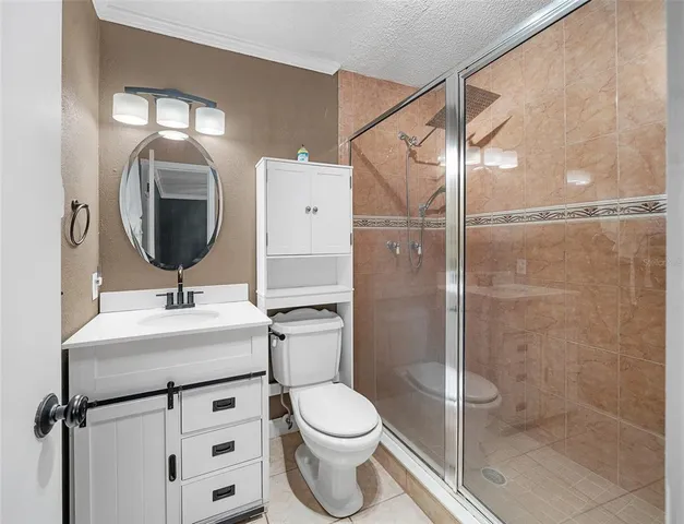 an empty room with closet and a hallway