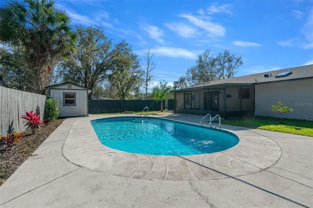 a backyard of a house with barbeque oven