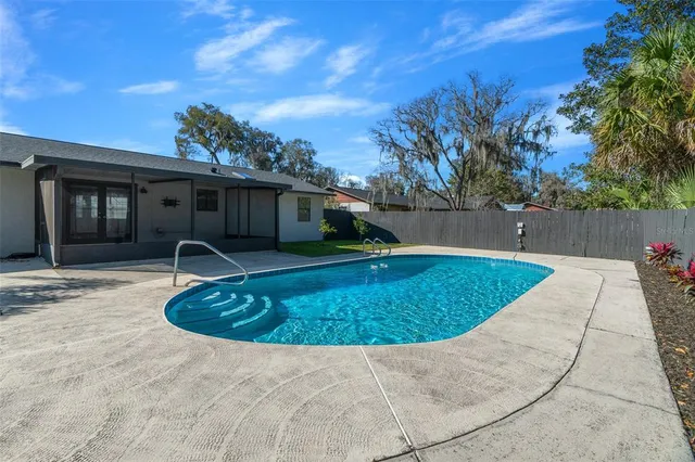 a front view of a house with a garden and yard